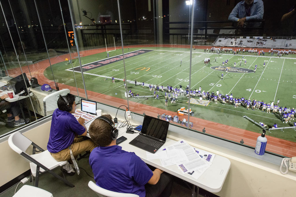 Sports media students commentating a football game