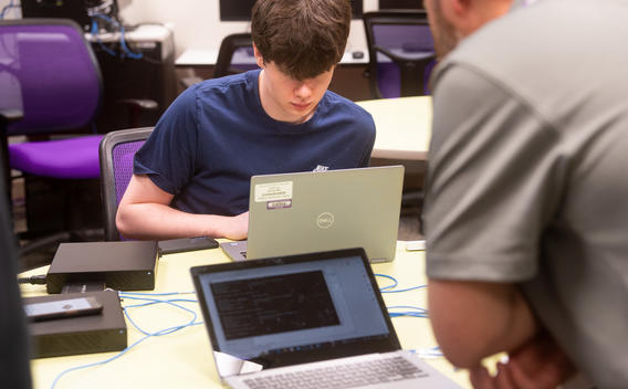 Cyber security student experimenting with ethernet connections